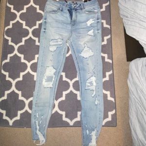 light blue ripped jeans